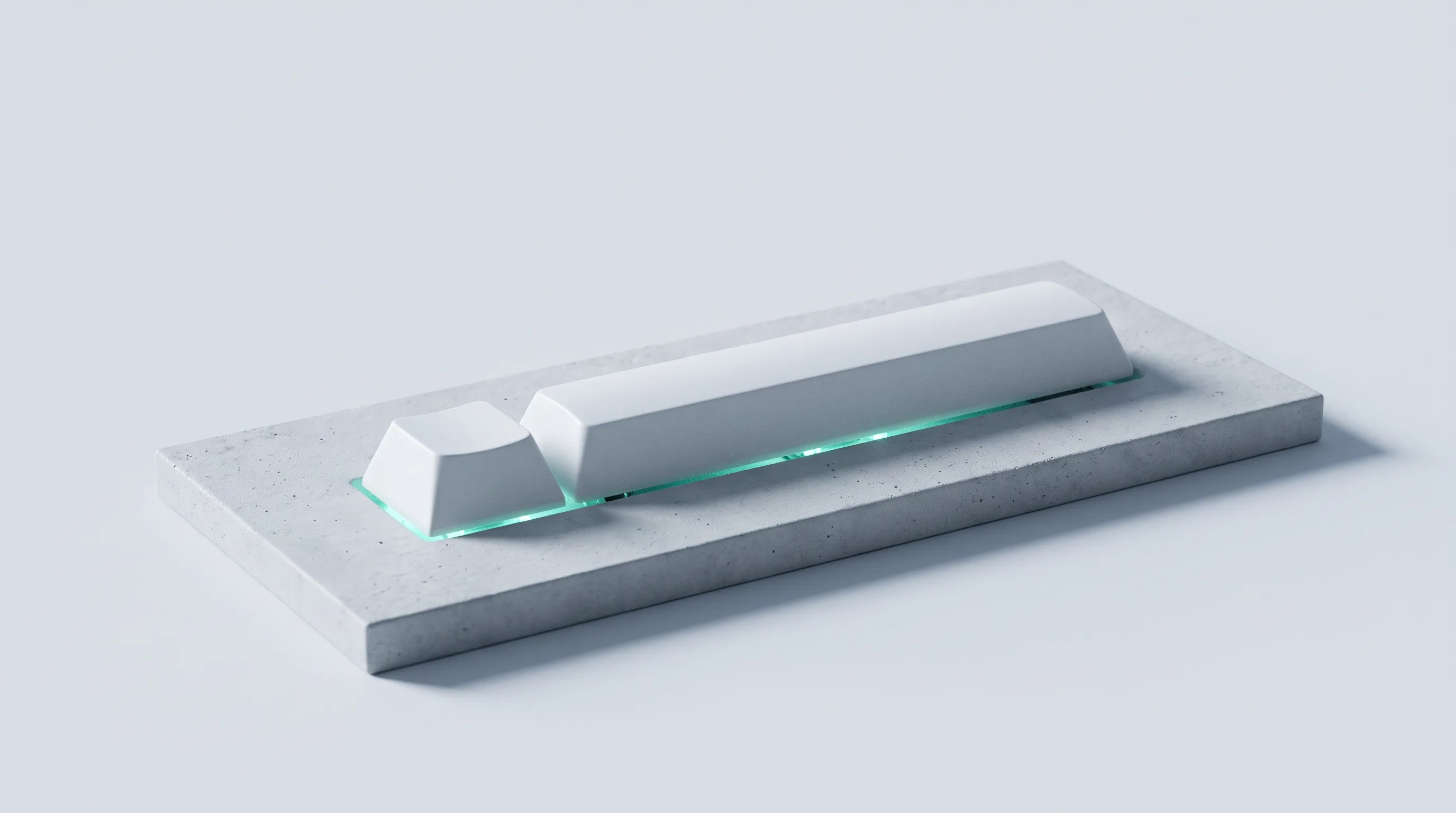 Dos teclas sobre una piedra, con una luz menta por debajo.